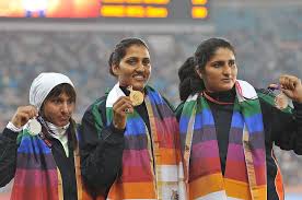  “Indian Women Sweep Discus Throw Podium at 2010 CWG with Krishna Poonia, Harwant Kaur, and Seema Antil”