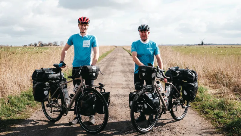  “Father-Son Duo Embark on Round-the-World Cycling Record Attempt”