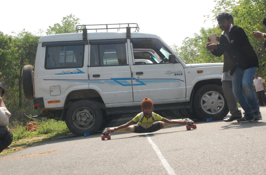  Chi.G. Devisri Prasad Sets World Record in Limbo Skating Under 50 Cars