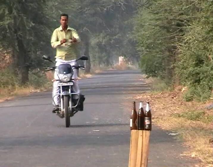  Blindfolded Bike Rider Breaks Glass Bottles While Standing — New Record Set!