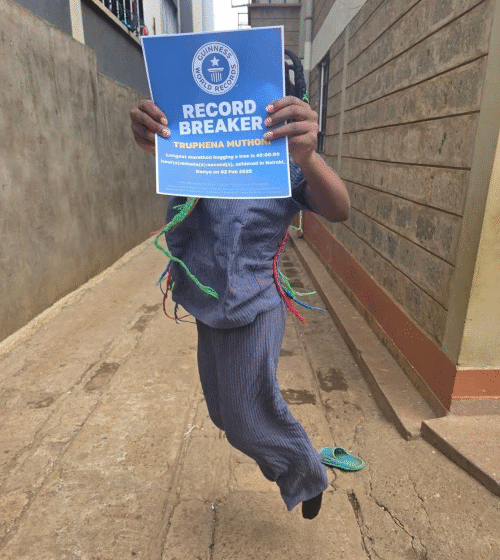  Truphena Muthoni Receives Guinness World Records Badge After Hugging a Tree for 48 Hours