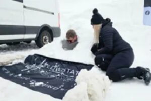 “Super Cool” Scots Nurse Attempts World Record After Lying in Snow for Hours